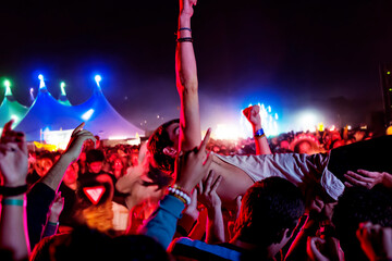 Wall Mural - Man crowd surfing at music festival