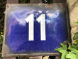 Bright blue sign that says 11