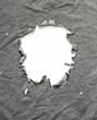 Ragged hole on a gray shirt