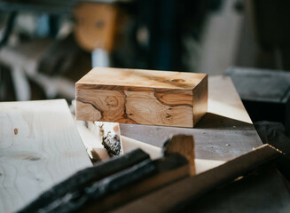 A wood block on a wooden carpentry table