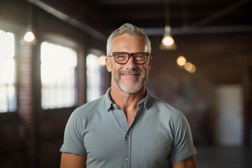 Lifestyle portrait photography of a satisfied mature man wearing a casual short-sleeve shirt against a spacious loft background. With generative AI technology