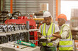 © Quality Stock Arts - African black people worker working together asist new young employee teamwork in metal factory.