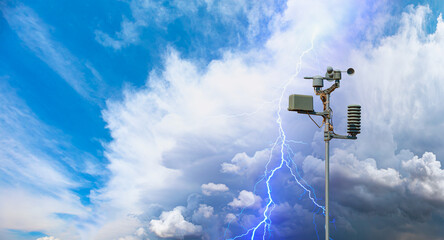 Wall Mural - weather station automatic measurement of weather parameters with stormy sky and lightning