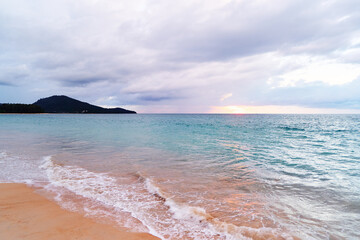 Wall Mural - Seascape with sunset on the ocean shore. Beautiful cloudy sky.