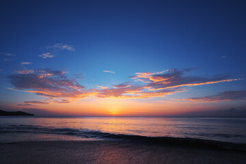 Wall Mural - Beautiful seascape with sunset cloudy sky.