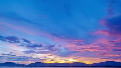 Wall Mural - Beautiful 4K Time lapse of Majestic sunrise or sunset clouds sky landscape,Amazing colorful light of nature cloudscape sky background