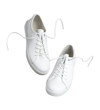 Sneakers Cut Out. White Leather Womens Sneakers Isolated On White Background. With Clipping Path. Stylish Sports Casual Shoes. Creative Minimalistic Layout With Footwear Mock Up For Your Design