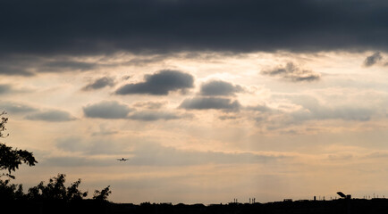 Canvas Print - Airplane flying in overcast sky