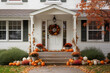 © fahrwasser - Cute and cozy cottage with fall decorations, pumpkins on the porch and a wreath, generative AI