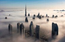 A City Covered With Fog Under The Burj Khalifa