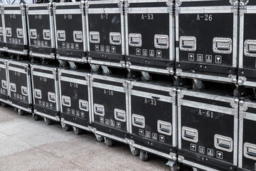 Black cases for musical equipment. Cases for audio equipment. Concept - brands of audio equipment. Rental of musical instruments. installation for organizing events in cases.