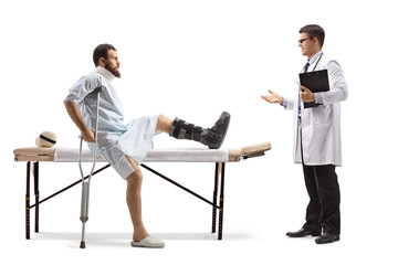 Sticker - Injured man with an orthopedic boot and neck collar sitting on a therapy table and having conversation with a doctor