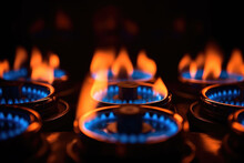 Gas Oven - Orange Tongues Of Blue Flame Of A Gas Burner Burn The Money