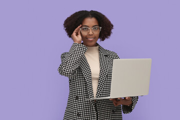 Sticker - African American intern working on laptop against purple background