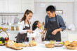 © Art_Photo - Portrait of enjoy happy love asian family father and mother with little asian girl daughter child play and having fun cooking food together with baking cookie and cake ingredient in kitchen