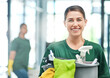 © Nicholas Felix/peopleimages.com - Happy, product and portrait of a woman with a cleaning service, tools and bucket for work. Smile, office and a young female cleaner with products to clean a workplace, disinfection staff and job