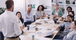 Diversity, businesspeople planning and sitting at table in a boardroom at workplace. Presentation or business meeting, collaboration and people talking or brainstorming together at their work