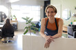 © Wavebreak Media - Portrait of smiling caucasian female hairdresser at reception desk in hair salon, copy space