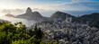 Rio de Janeiro from above during a beautiful summer morning. Panoramic landscape with the skyline of Rio city, view to Sugar Loaf landmark and Copacabana beach. Travel to Brazil.