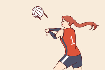 Woman volleyball player tosses ball to score goal for opposing team during tournament or training match. Girl volleyball player makes career in professional sports and plays under first number