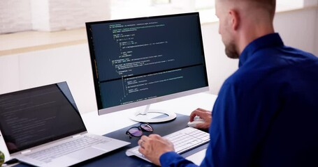 Fototapete - Computer Programmer Writing Program Code On Computer