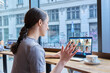 © Valerii Honcharuk - Video conference, laptop screen with group of students and teacher, teen girl in cafe