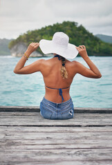 Sticker - Travel, ocean and woman relax on deck for holiday, summer vacation and weekend getaway in Maldives. Island, tropical beach and back of female person on luxury resort for tourism, sea and adventure