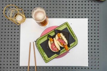 Poster - Top view of Chinese traditional chicken bao served on a green plate