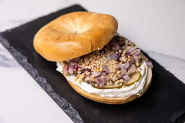 Poster - Bagel sandwich with meat and other ingredients