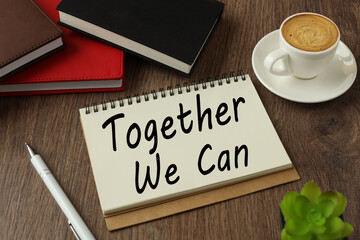 Together We Can text on torn paper. on wooden cubes. wooden background