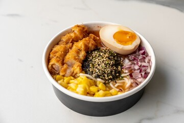 Poster - Delicious ramen bowl with meat and an egg served on the marble table