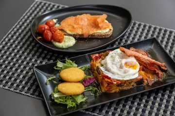 Wall Mural - Closeup of delicious served food on a table in a restaurant