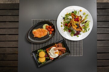 Wall Mural - Closeup of delicious served food on a table in a restaurant