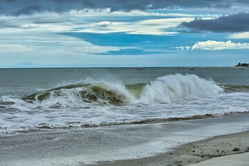 Beach of the sea with blue sky in the background on a cloudy day