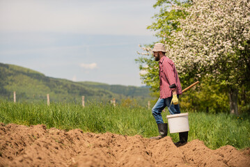 Sticker - Male farmer working on an agricultural fields.