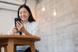 © panitan - woman using cell phone hand holding mobile texting message contact us.chatting,search internet information.technology device communication connecting