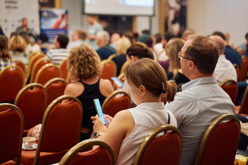 Wall Mural - Speaker at Business Conference and Presentation. Audience at the conference hall.