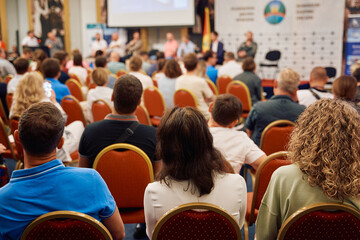 Wall Mural - Speaker at Business Conference and Presentation. Audience at the conference hall.