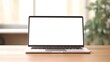© Wanda - Laptop with blank screen on table workspace laptop showing blank screen background