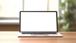 © Wanda - Laptop with blank screen on table workspace laptop showing blank screen background