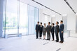 © kapinon - 日本人（アジア系）のビジネスマンチーム複数名が未来を見上げる　全員集合の広角　コピースぺースあり