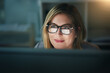 Businesswoman, glasses and working late on a computer or or overtime for a project deadline or schedule and in an office. Research, email and face of corporate worker or analysis and online at night