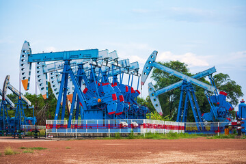 Wall Mural - In the field country crude oil industry the oil rig pump in the evening of the pumping