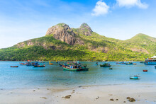 Ben Dam Port In Con Dao Island, Vietnam With Beautiful Blue Sea Blue Sky Mountain And Colorful Boats.