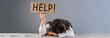 © Daniel - Tired woman holding help inscription