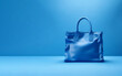 © artistic - women handbag on a blue background. Blue female bag. stylish new woman's bag with blue background copy space. female bag banner. Generative Ai