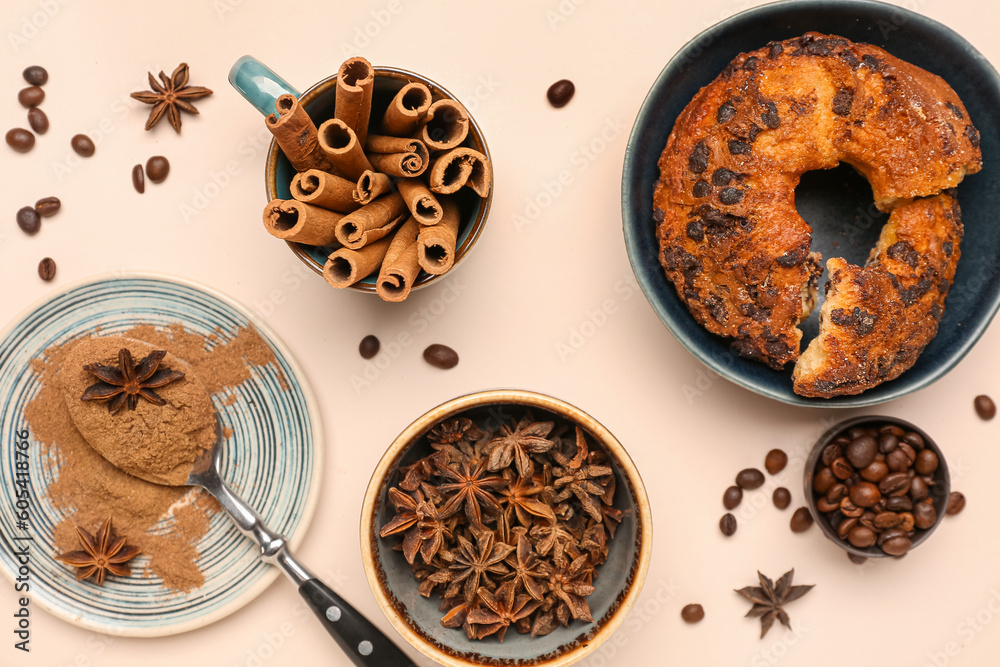 Composition with cinnamon sticks, powder, coffee beans, anise stars and cake on light background