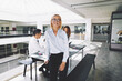 © Flamingo Images - Smiling young businesswoman at work