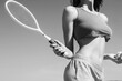 © Yevhen - Girl holding racket. Of beautiful athletic girl in stylish sportswear holding racket in hand, to play tennis outdoors. Black and white