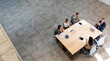 © BGStock72 - Aerial view at young startup team working in the office